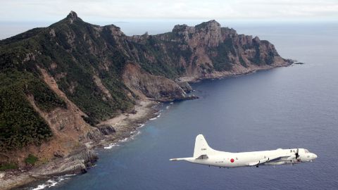 A Japanese military plane flies over the Senakuku/Diaoyu islands in this file photo.