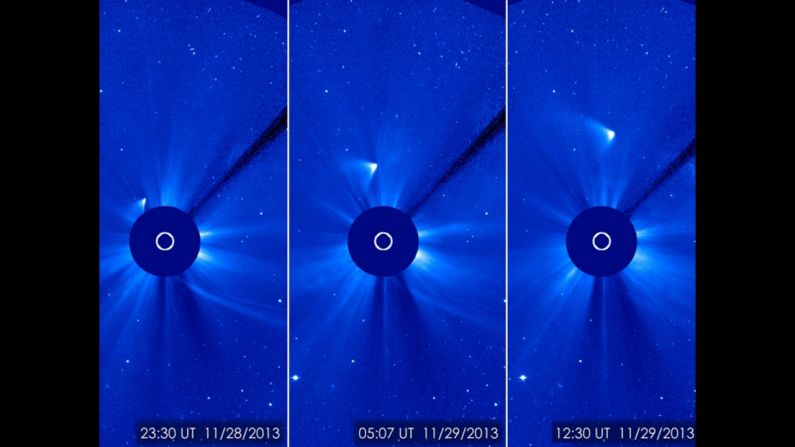 Comet ISON appears as a white smear heading up and away from the sun on Thursday, November 28. Scientists initially thought the comet had been disintegrated by the sun, but images suggest a small nucleus may still be intact.