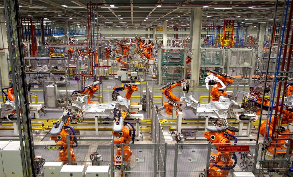 Robots are already being used to produce cars, like those pictured here waiting to build the new Mini Cooper. Robots will increasingly be used for household chores