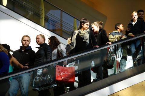 Shoppers crowd onto an escalator at the Somerset Collection mall in Troy, Michigan, on November 29. 
