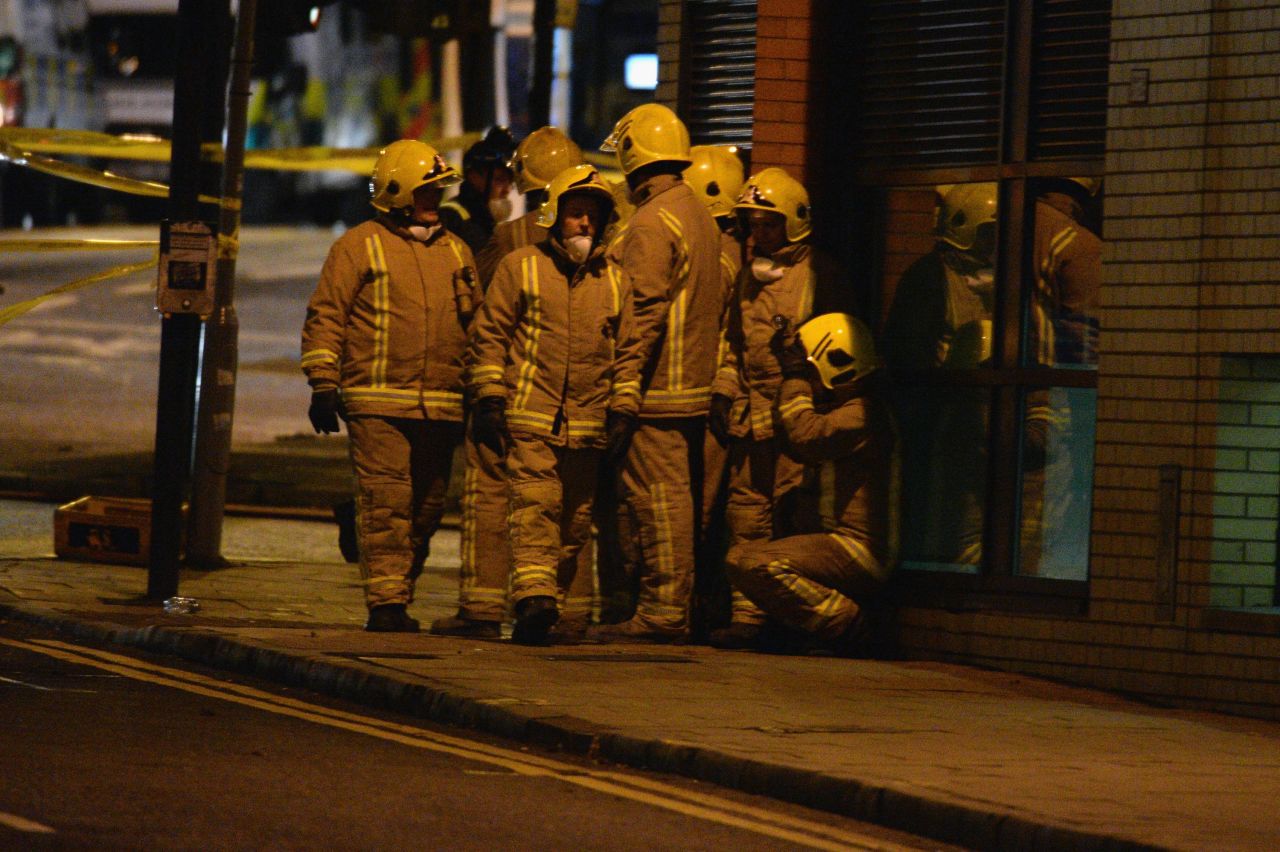 Rescue workers gather near the scene of the crash.