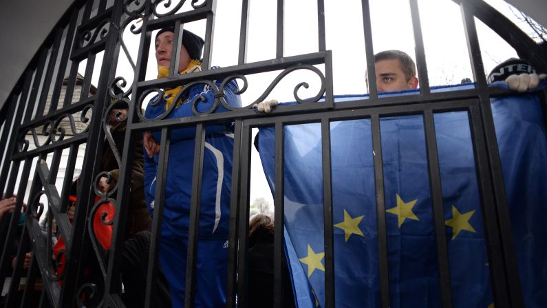 Opposition supporters hold EU flags November 30 as they guard the gates of the Mikhailovsky monastery.