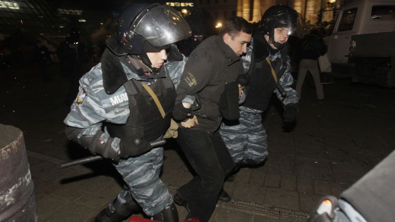 Ukrainian riot police detain a protester on November 30.