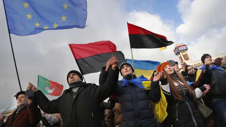 Demonstrators hold hands during a rally on November 29.