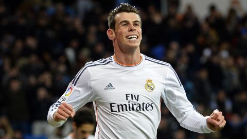 A beaming Gareth Bale celebrates after completing his hat-trick against Real Valladolid on Saturday.   