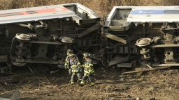 Emergency workers at the scene of a commuter train wreck on Dec 1, 2013 in the Bronx borough of New York. The train bound for New York's Grand Central Station derailed in the Bronx Sunday with at least four people reported dead after several rail cars left the tracks near the Spuyten Duyvil railroad station. The southbound train was traveling from Poughkeepsie to Grand Central Terminal when the accident occurred. AFP PHOTO / TIMOTHY CLARY        (Photo credit should read TIMOTHY CLARY/AFP/Getty Images)