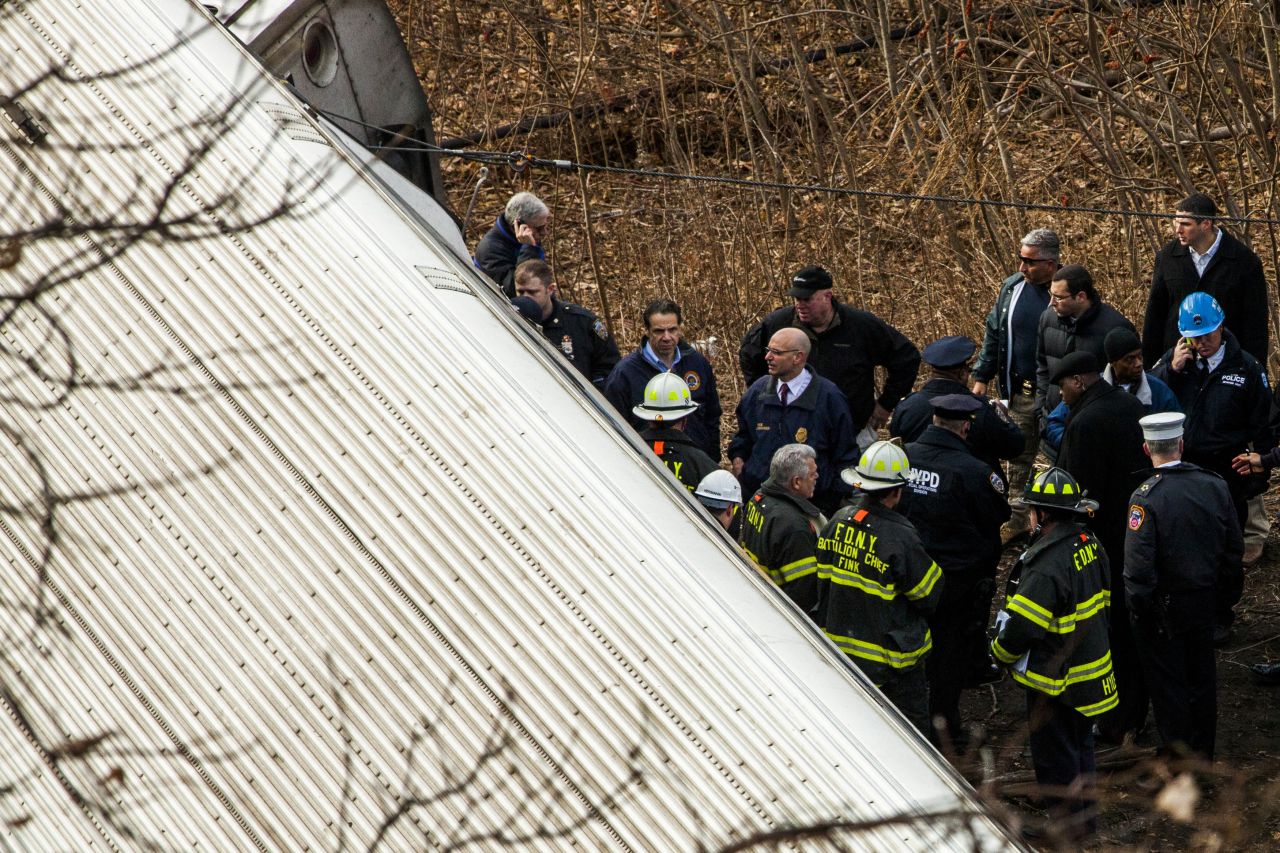 Cuomo inspects the damage along with emergency crews.