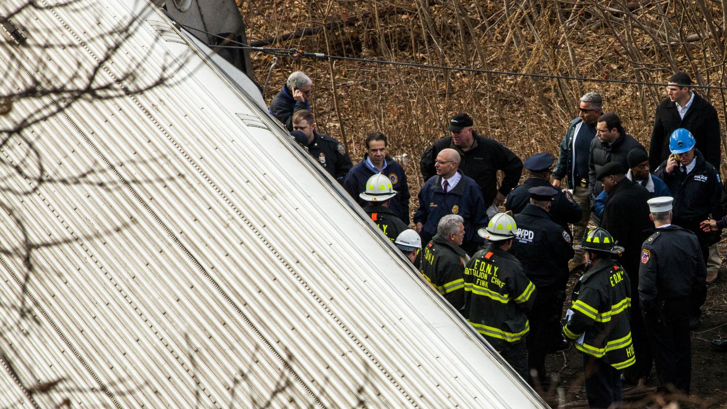 New York Gov. Andrew M. Cuomo, third from left, inspects the damage after a Metro-North train derailed in December.