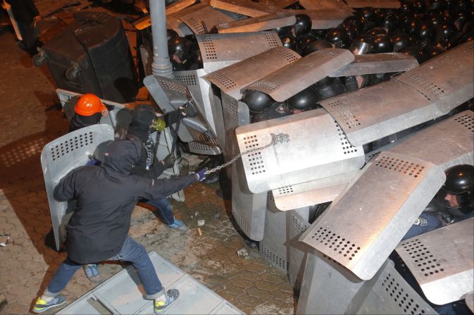 Protesters clash with police guarding the presidential administration building on December 1.