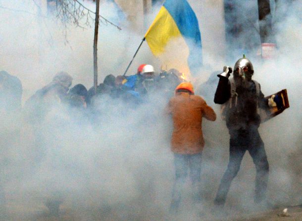 Pro-EU demonstrators clash with police near the presidential administration office on December 1.