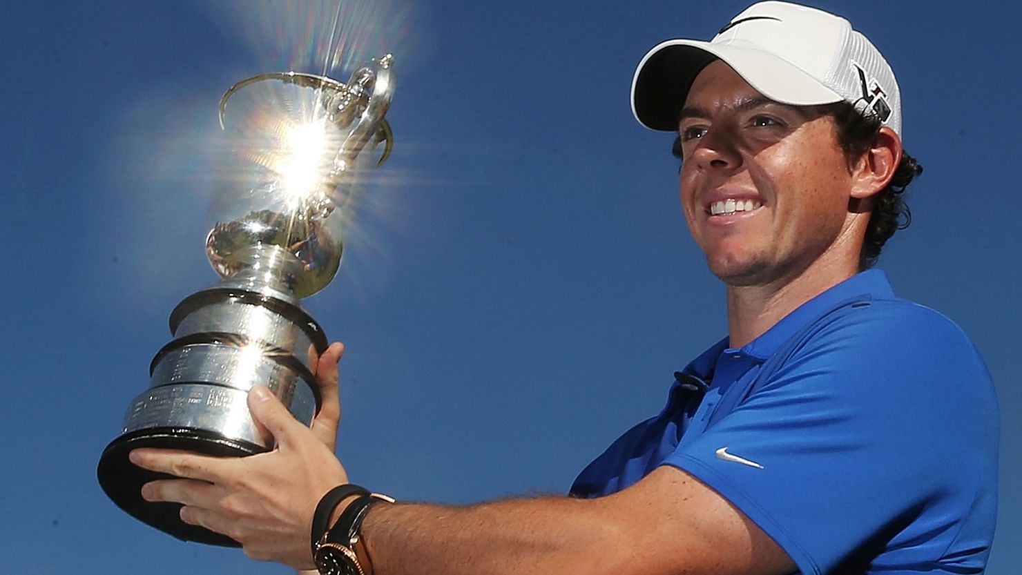 Rory McIlory gets his hands on a trophy at last in 2013 after a dramatic one-shot victory over Adam Scott at the Australian Open.