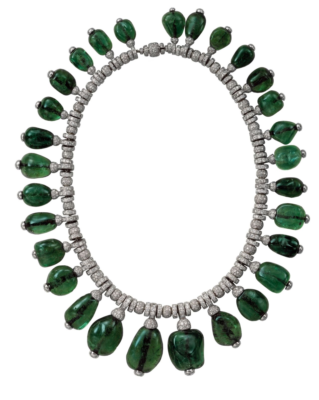 Cartier emerald necklace commissioned in 1938 by Merle Oberon. Flexible chain in round-cut diamonds with 29 graduated emerald cabochons, tipped with diamonds, suspended from it. 