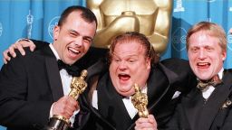 Filmmakers Tyron Montgomery(L) and Thomas Stellmach(R) pose with comedian-actor Chris Farley(C) after they won the Oscar for best animated short film for 'Quest' 24 March during the 69th Annual Academy Awards in Los Angeles, California.