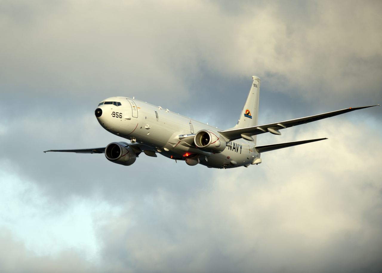 A P-8A Poseidon, the Navy's newest anti-submarine warfare and surveillance plane, conducts flyovers above the Enterprise Carrier Strike Group during exercise Bold Alligator 2012.