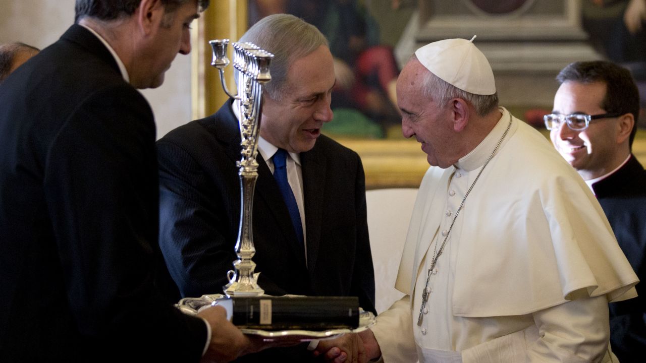 Israeli PM Benjamin Netanyahu presents Pope Francis with a Menorah during their meeting at the Vatican, Monday, December 2.