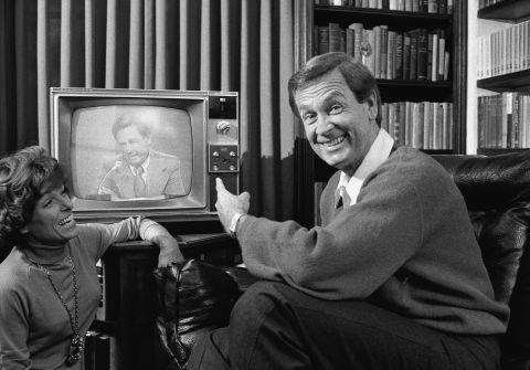 Barker points to himself on television as his wife looks on and laughs in 1977. Dorothy Jo died from lung cancer in 1981.