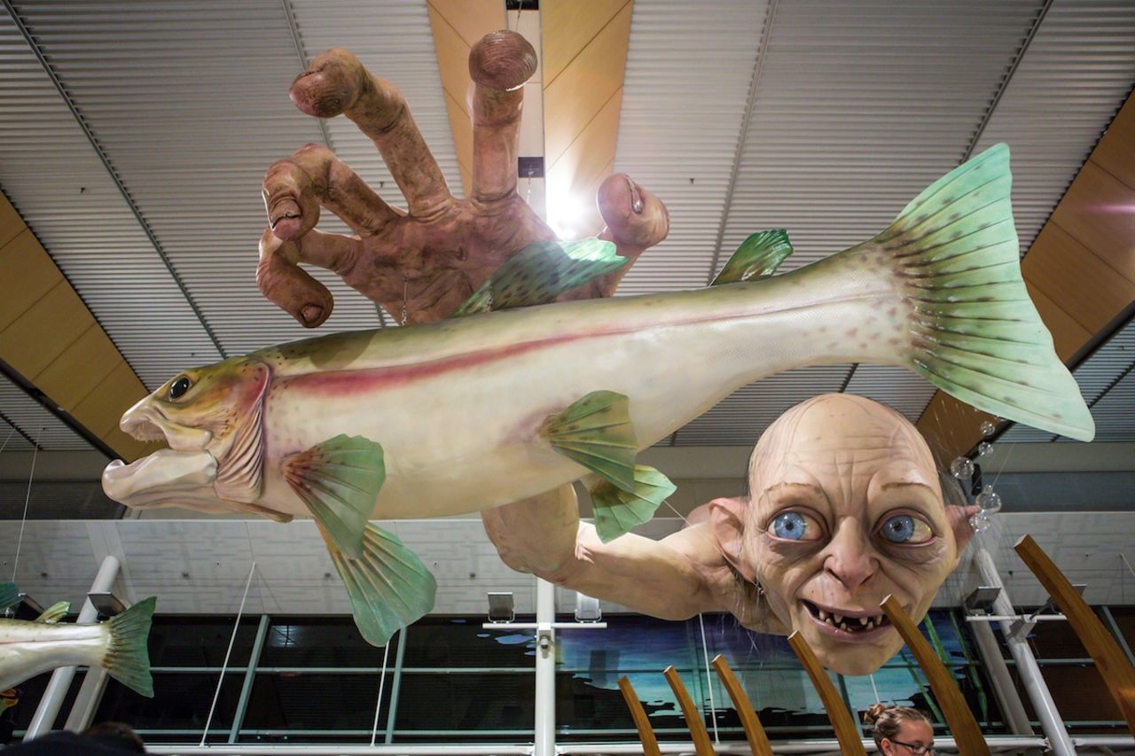 Good luck eating with that staring down at you. Wellington International Airport's new Hobbitt-themed sculptures join this existing installation featuring Gollum fishing for trout, which has been suspended above the airport's food court since late last year. 