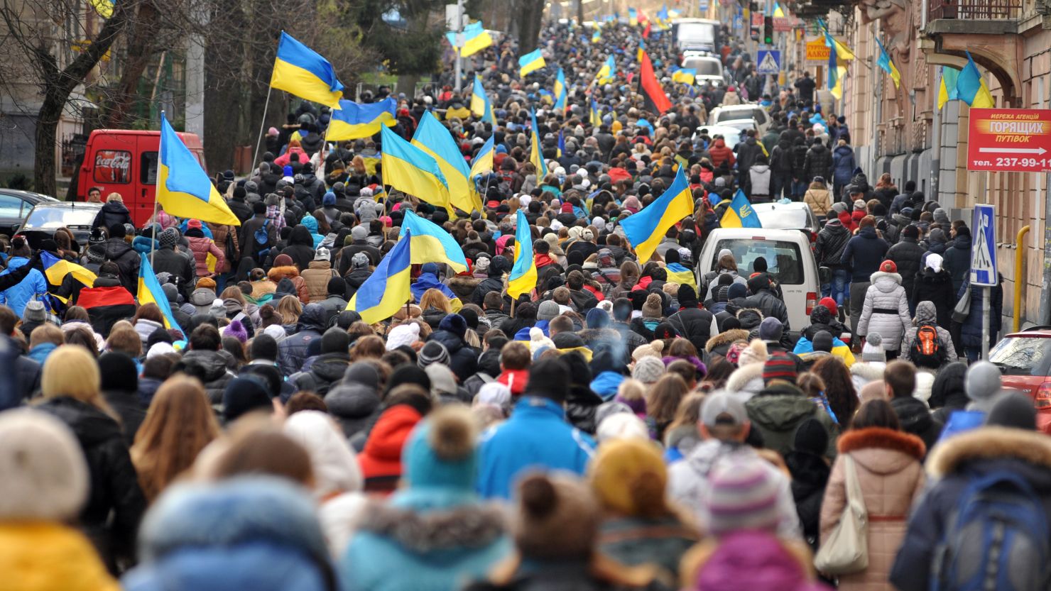 Thousands of demonstrators march in the western Ukrainian city of Lviv on Monday.