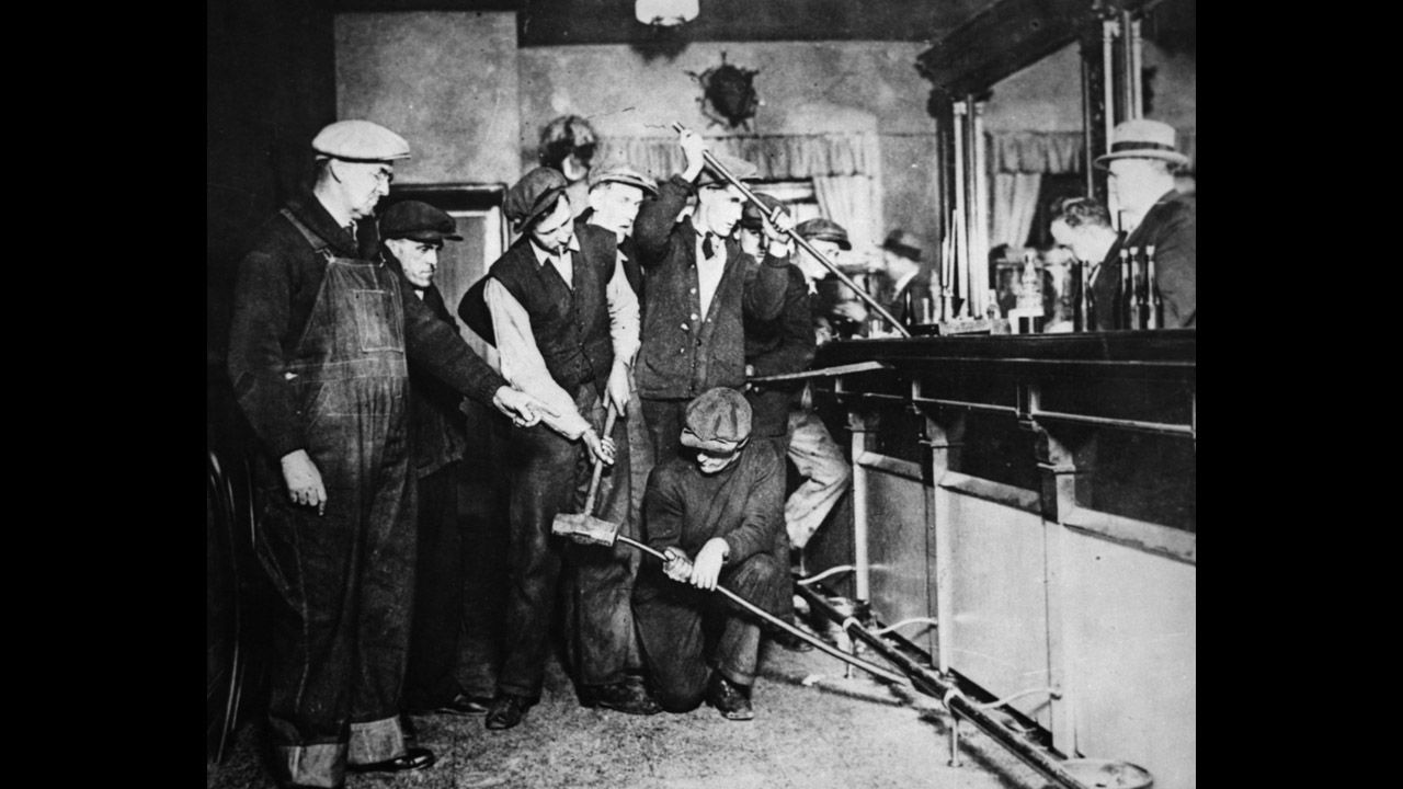 Federal agents search for liquor in a bar in the 1920s. On December 22, 1917, with a majority vote, Congress submitted the 18th Amendement to the Constitution, which prohibited "the manufacture, sale, or transportation of intoxicating liquors." 