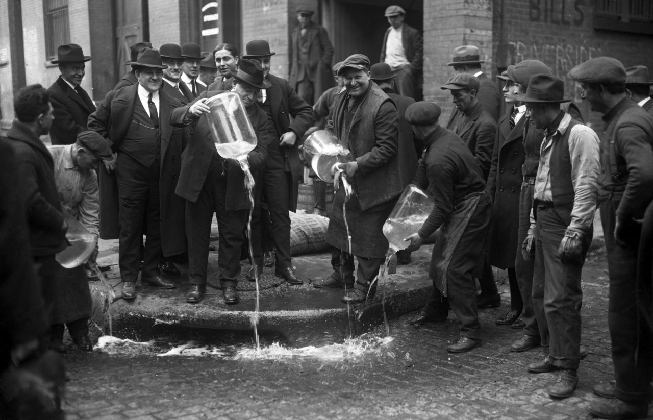 New York City Liquor Agent Izzy Einstein dumps liquor into gutter. Congress passed the National Prohibition Act, usually called the Volstead Act because Congressman Andrew Volstead of Minnesota introduced it in 1919, to enforce the 18th Amendment. 