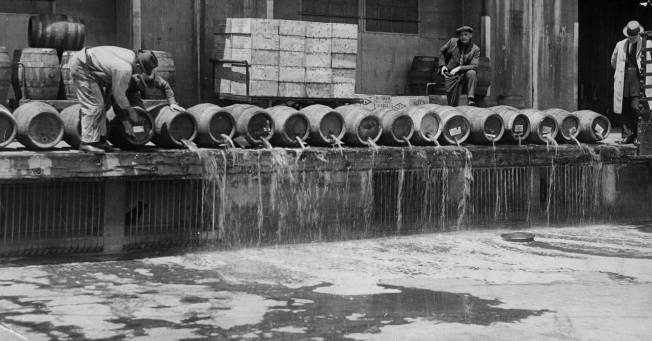 At an Army base in Brooklyn, men drain 10,000 barrels of beer into New York Harbor in 1925.
