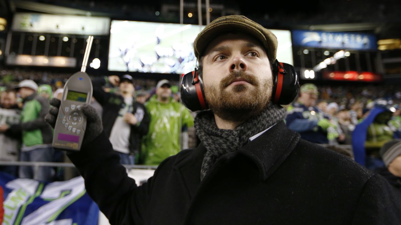 Matt Roe, an acoustical consultant with SSA Acoustics, measures noise levels in CenturyLink Field.