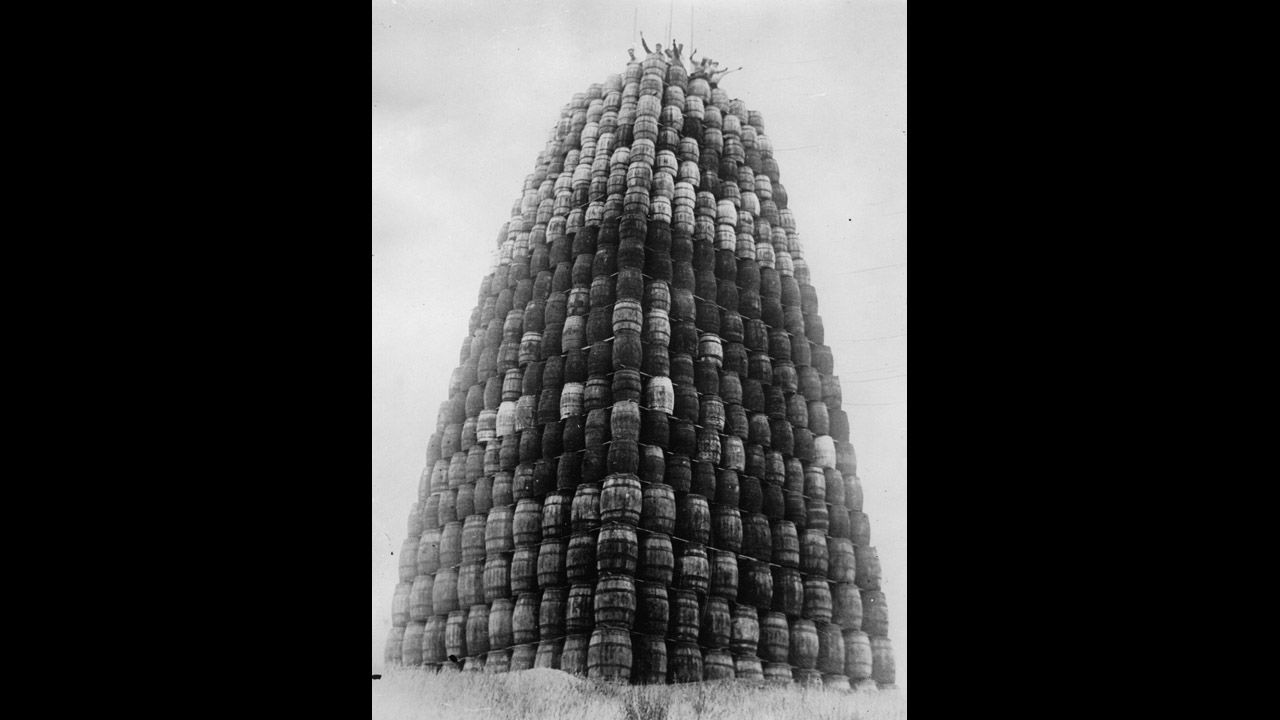 A tower is built with barrels of alcohol to be burned during Prohibition in 1930. 