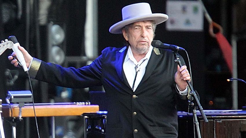 FILE - This July 22, 2012 file photo shows U.S. singer-songwriter Bob Dylan performing on stage at "Les Vieilles Charrues" Festival in Carhaix, western France. French authorities have filed preliminary charges against Bob Dylan over an interview in which he is quoted comparing Croatians to Nazis and the Ku Klux Klan. Paris prosecutor's office spokeswoman Agnes Thibault-Lecuivre said Monday the charges of "public insult and inciting hate" were filed in mid-November.The charges stemmed from a lawsuit by a Croatian advocacy group in France over an interview in Rolling Stone magazine in 2012. (AP Photo/David Vincent, file)