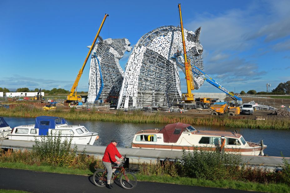 The Kelpies are a tribute to Scotland's industrial past and the working horses that used to pull barges along its canals and also work in the fields where they now stand.