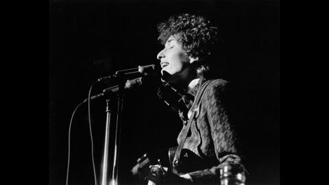 Dylan performs on stage in the 1960s. Dylan was known in his early career for playing the guitar and the harmonica, and for his distinctive vocal phrasing.
