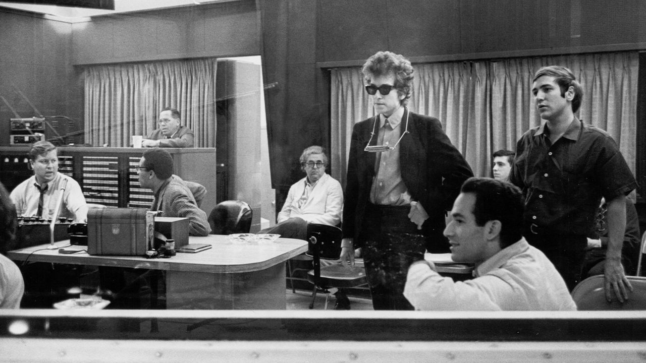 Dylan listens to recordings of his album "Highway 61 Revisited" in 1965. It contained "Like a Rolling Stone," which went to No. 2 on U.S. charts.