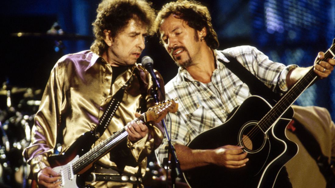Dylan and Bruce Springsteen perform together in 1990.