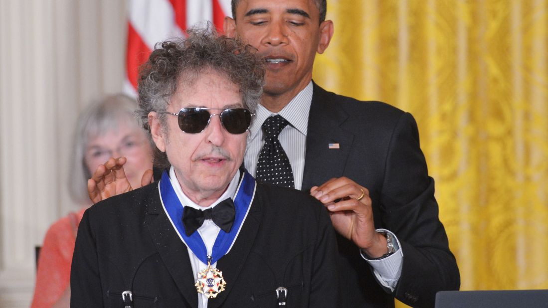 President Barack Obama presents the Presidential Medal of Freedom to Dylan in the East Room of the White House in 2012. The award is the country's highest civilian honor. "I remember, you know, in college, listening to Bob Dylan and my world opening up, 'cause he captured something about this country that was so vital," Obama said. 