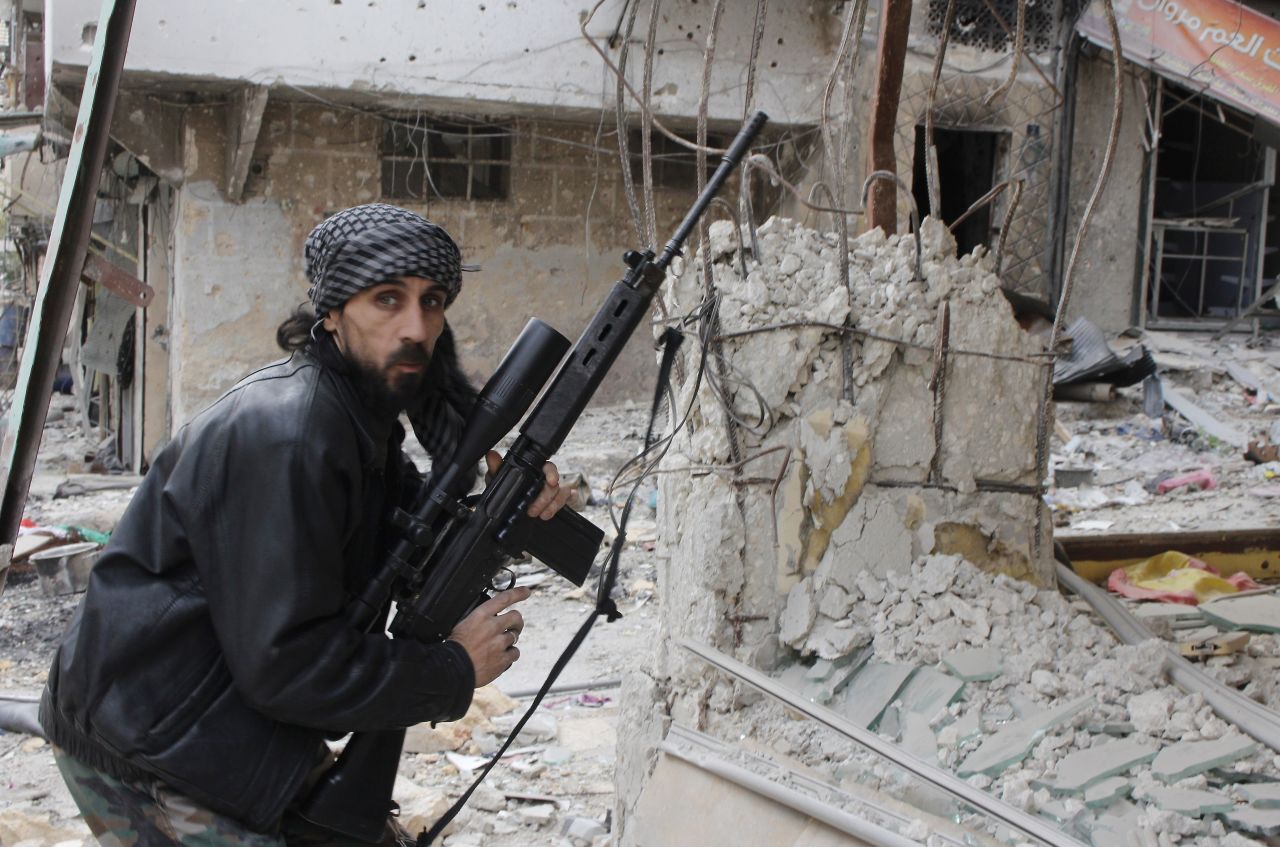 A rebel fighter from the Free Syrian Army holds a position at a front line in the Salah al-Din neighbourhood of the northern Syrian city of Aleppo, on December 1, 2013. The stricken nation dropped nine points from 144th place to 168th in the index.
