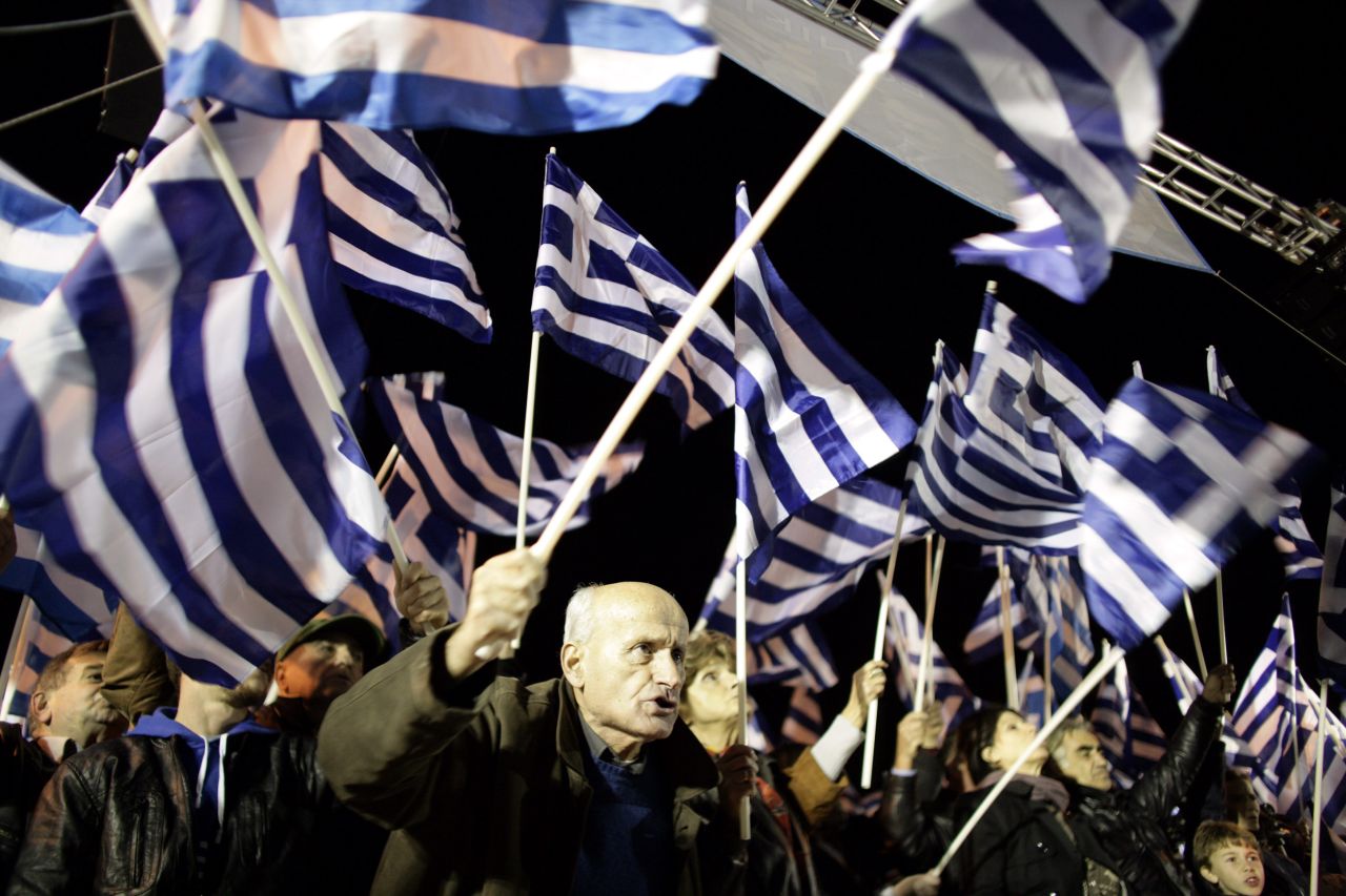 Greece's score rose four points this year to 40, but remained the lowest ranking country in the European Union in 80th place on the index. <br />Pictured here, supporters of the ultra-nationalist party <a href="http://cnn.com/2013/10/07/business/greeces-golden-dawn-firebrand-right-wingers/">Golden Dawn</a> demonstrate outside parliament on November 30, 2013 in Athens, Greece. 