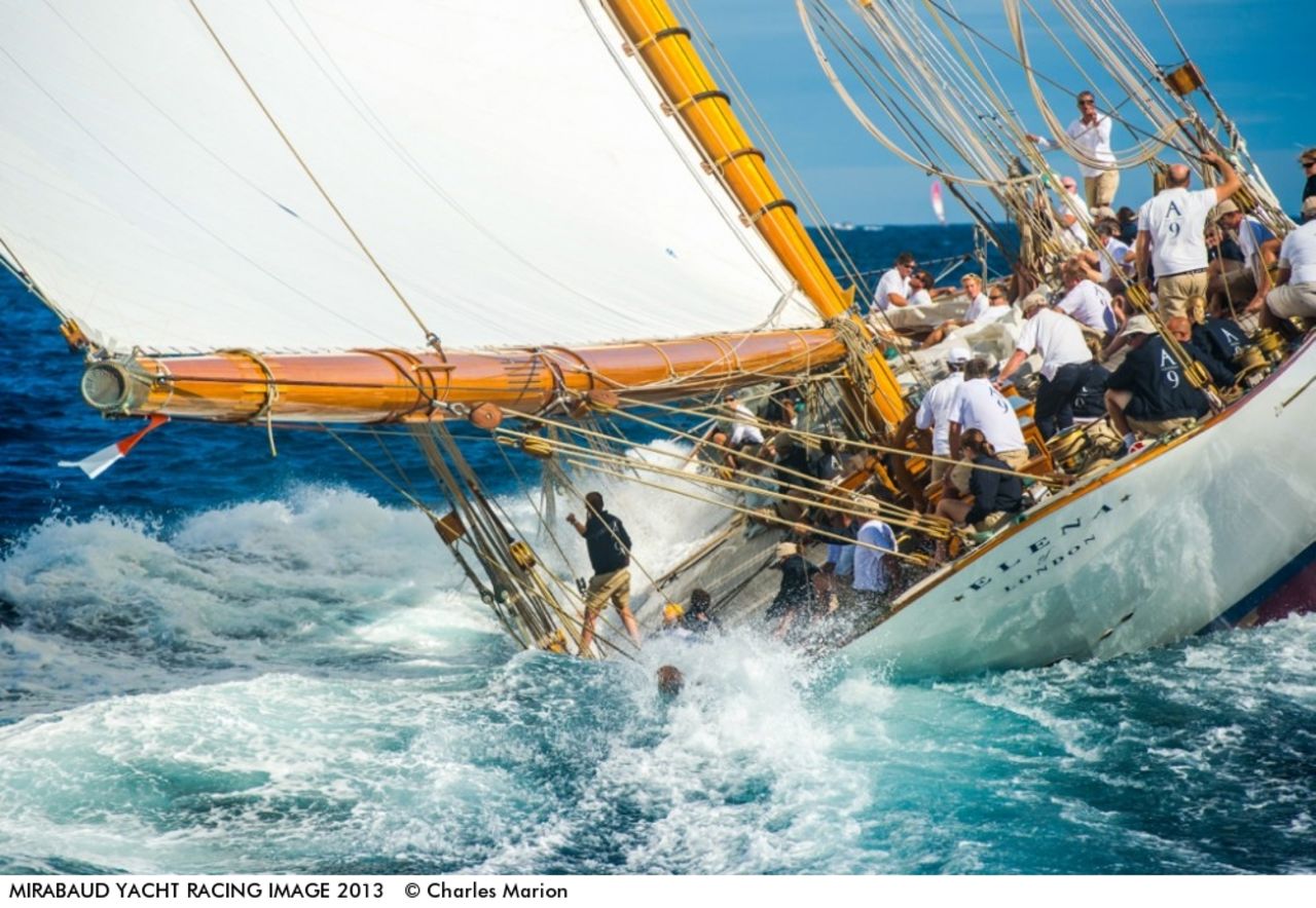 Some pictures highlight the treacherous nature of the seas -- not that the yachtsman in question here looks unduly concerned as he appears to dip into the water on-board the sailboat Elena.