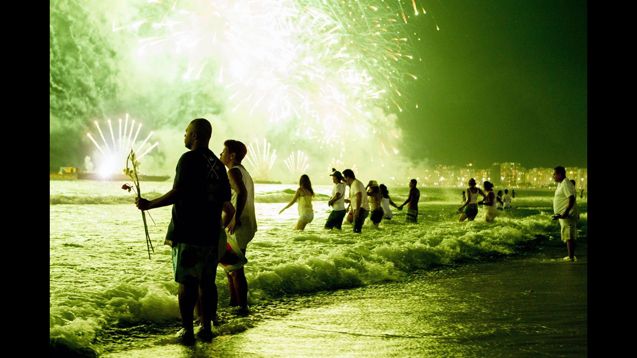 <strong>January 1:</strong> People watch New Year's fireworks along Copacabana Beach in Rio de Janeiro, Brazil. Photographers worldwide captured deadly conflicts, devastating storms and other memorable moments throughout the year. Click through the gallery to see 2013 unfold from beginning to end.
