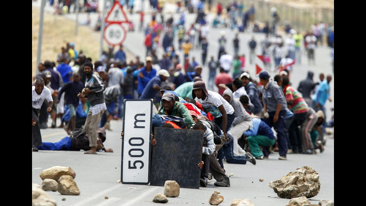 <strong>January 10:</strong> Protesters advance on police in De Doorns, South Africa. Farmworkers across the Western Cape were on strike at the time, demanding that their wages of 65 rand a day ($7.50 U.S.) be doubled.