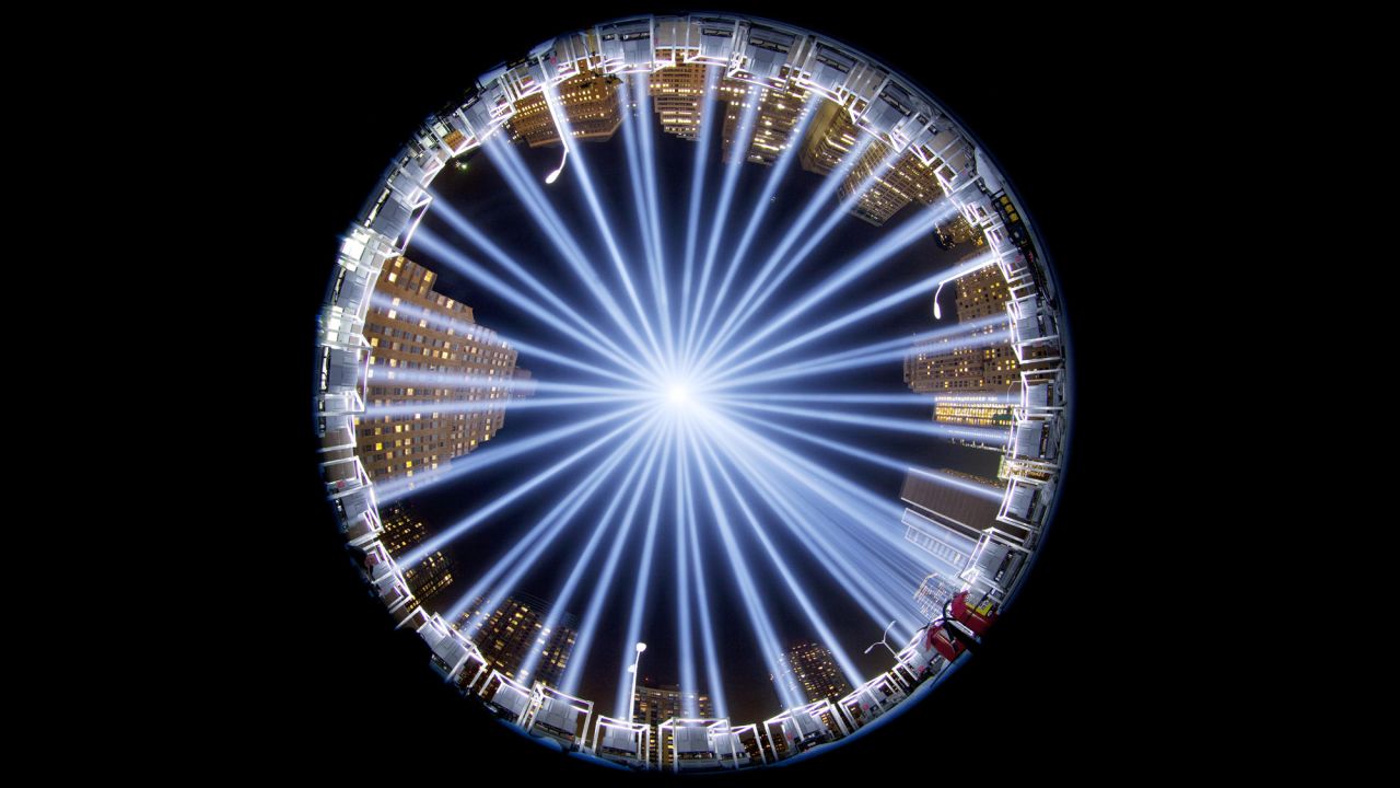 <strong>September 10:</strong> The Tribute in Light, a collection of 88 searchlights next to the site of the World Trade Center, is seen through a fish-eye lens as it rises above buildings in lower Manhattan.