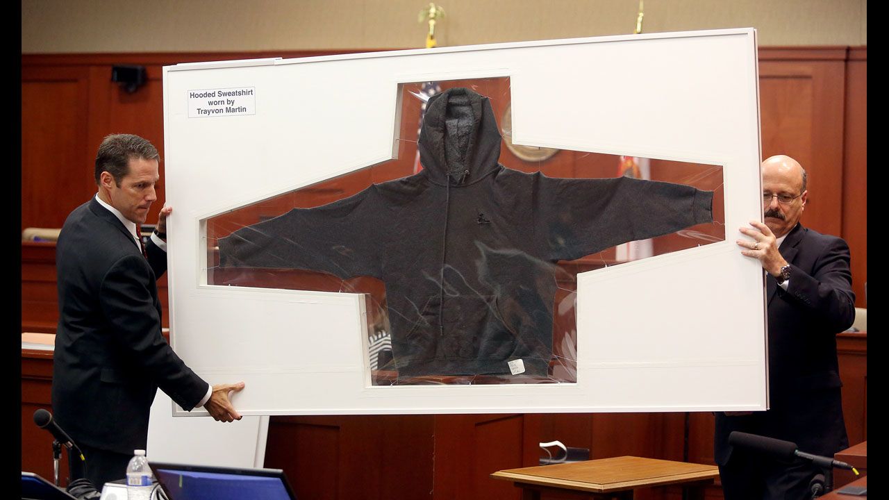 <strong>July 3:</strong> Assistant State Attorney John Guy, left, and Assistant State Attorney Bernie de la Rionda display the hooded sweatshirt worn by teenager Trayvon Martin on the night he was shot by neighborhood watch captain George Zimmerman in Sanford, Florida. A jury found Zimmerman not guilty of second-degree murder.