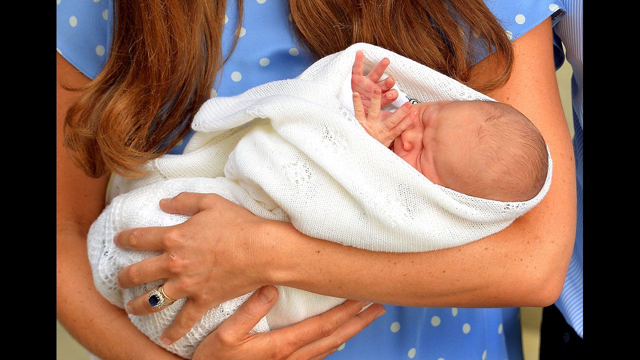 <strong>July 23:</strong> The Duchess of Cambridge holds her newborn son, Prince George, outside St. Mary's Hospital in London. George is third in line to the British throne after his grandfather Prince Charles and his father, Prince William.