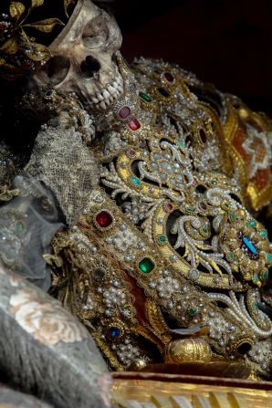 <em>St Valentinus in Waldsassen, Czech Republic, wears a biretta and an elaborate, elegantly jeweled version of a deacon's cassock to emphasize his ecclesiastical status</em><br /><br /><strong>CNN:</strong> <strong>Which town or church has the best collection of jeweled skeletons today?</strong><br /><br /><strong>PK:</strong> Waldsassen still has ten of these skeletons, all on display, all still resplendent. It's the finest display of jeweled skeletons that still exists. It's like the Sistine Chapel of death in there. The incredible display includes one skeleton on each side altar, ten of them, and then two decorated skeletal busts behind the high altar, for a total of twelve, one for each month of the year. When people write to me, which they often do, and say, "If I want to see some of these in person, where should I go?," I always tell them to go to Waldsassen. It's an intact, incredible display of jeweled skeletons.