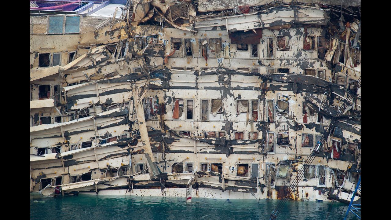 <strong>September 17:</strong> The severely damaged side of the Costa Concordia is visible after it was successfully lifted upright in Isola del Giglio, Italy. The cruise ship capsized last year.