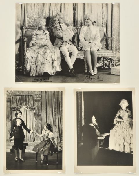 Princess Margaret (L) and Princess Elizabeth (R) on stage in a pantomime of Cinderella at Windsor Castle in 1941. Photos of the sisters in four plays during World War II are up for auction.