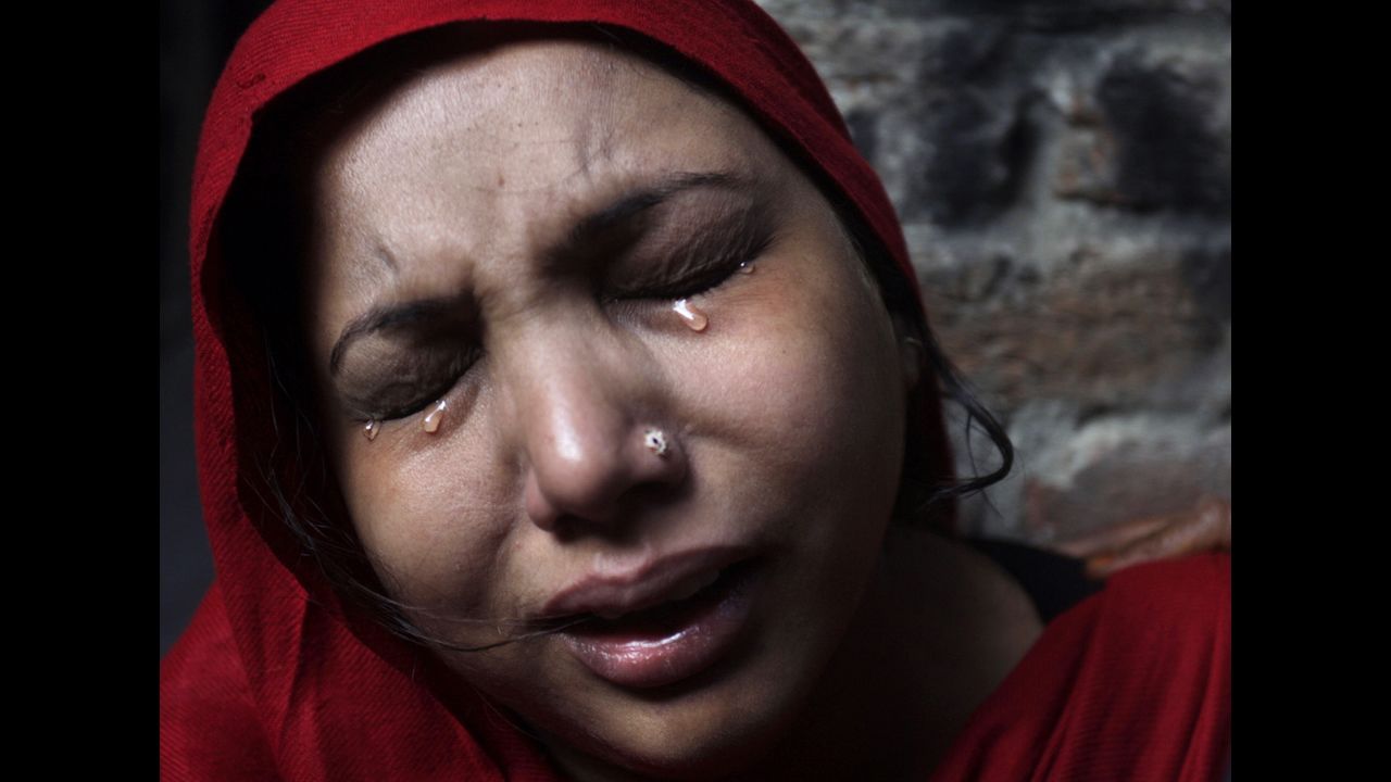<strong>March 10:</strong> A Pakistani Christian woman weeps after her home was damaged by an angry Muslim mob during clashes between Christians and Muslims in Lahore, Pakistan.