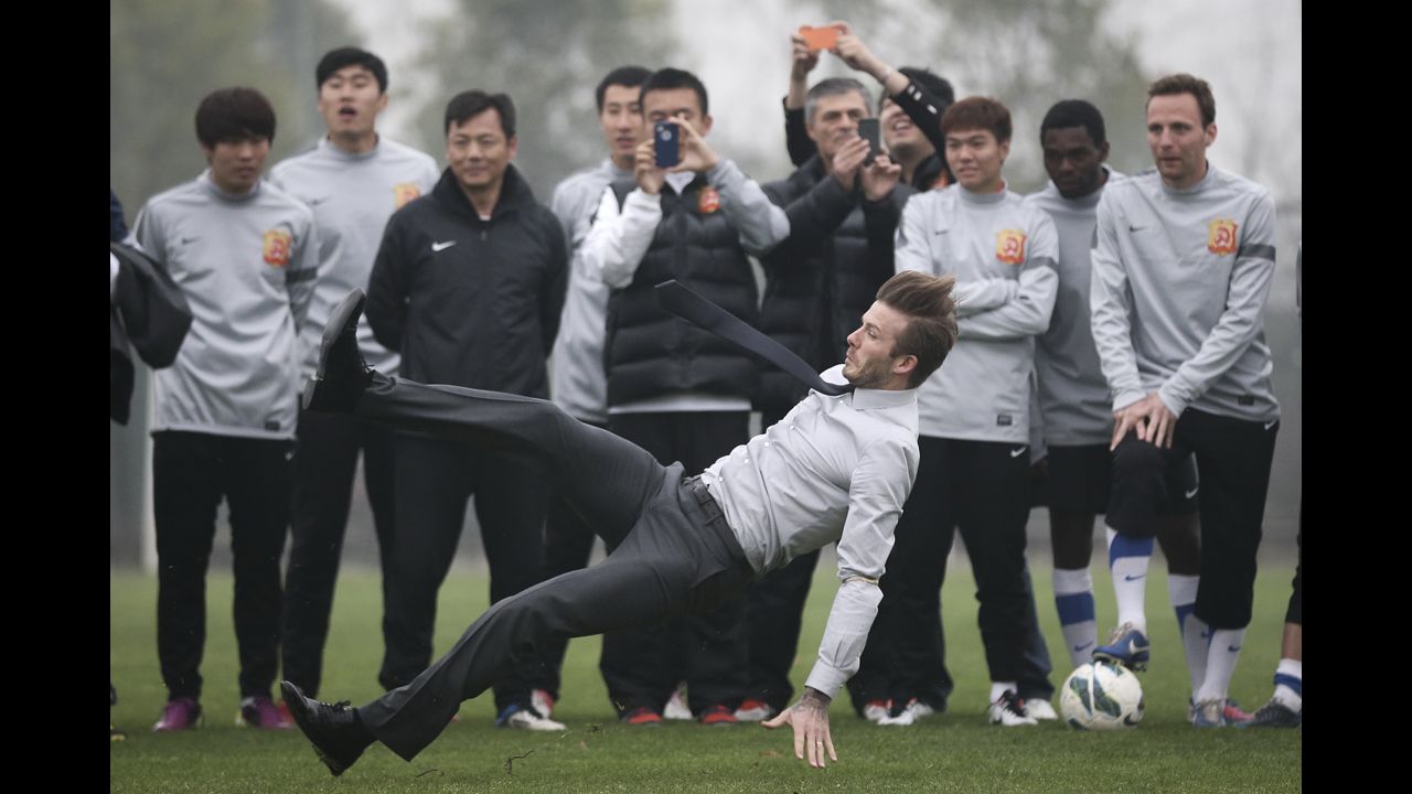 <strong>March 23:</strong> Soccer star David Beckham falls during a visit with Wuhan Zall, a professional team in Wuhan, China.