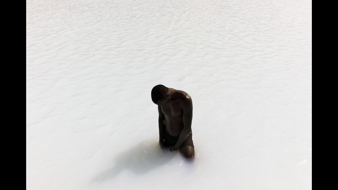 <strong>April 30:</strong> A drilling worker takes a break in an unfinished geothermal pool next to the Kenya Electricity Generating Company's two active geothermal plants. Kenya was the first African country to build geothermal energy sources.