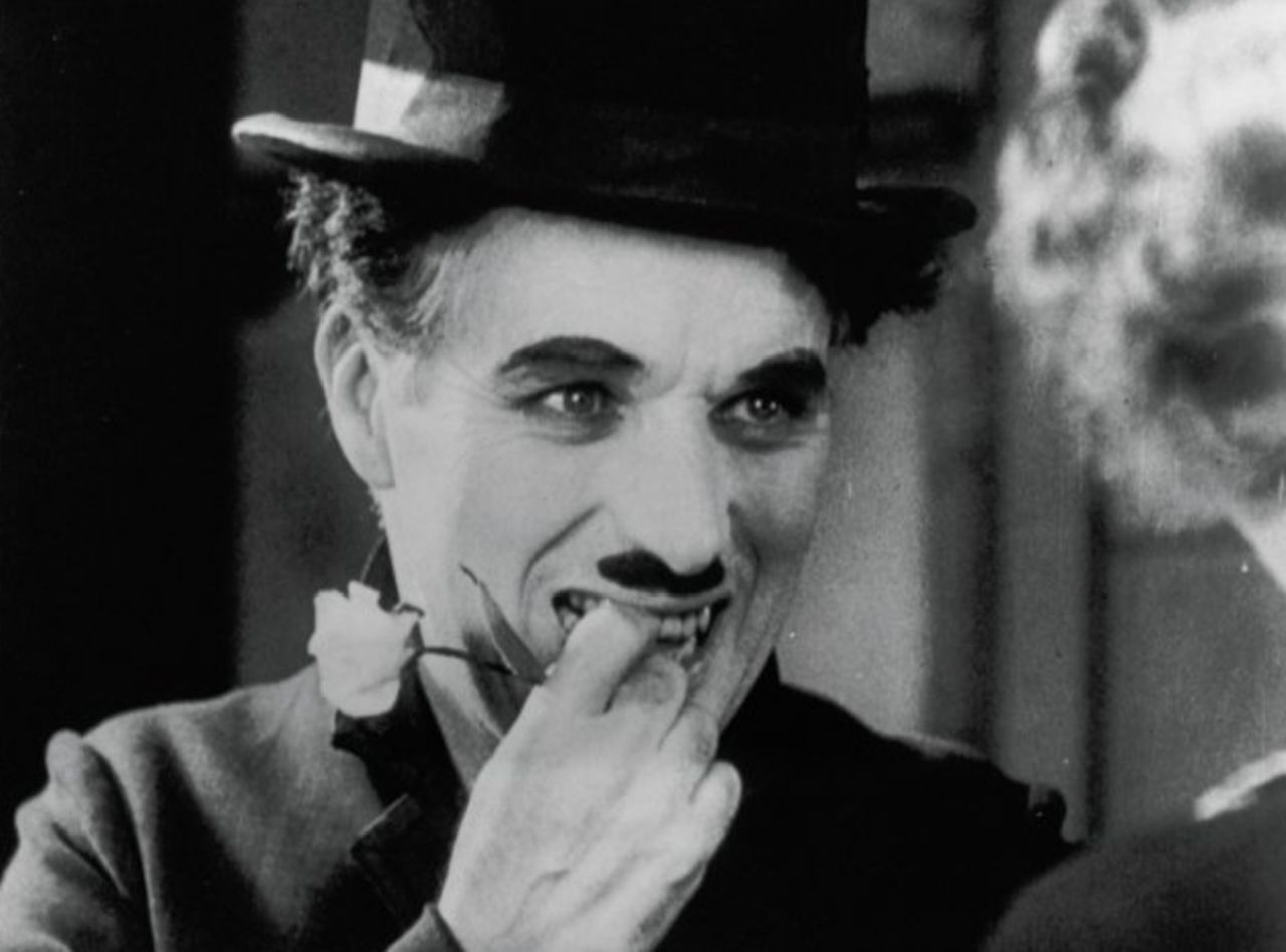 Charlie Chaplin performs in 1931 film "City Lights." New behind-the-scenes footage reveals the actor and director made his co-star, Virginia Cherrill, re-do one scene 342 times.