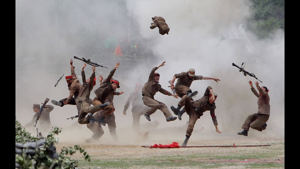 <strong>June 22:</strong> South Korean soldiers wear North Korean military uniforms as they take part in a Korean War re-enactment in Chuncheon, South Korea.