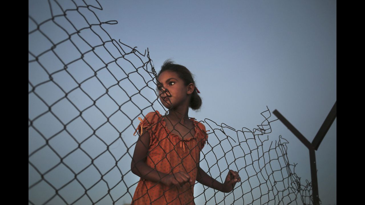 <strong>July 29:</strong> A Palestinian girl plays beside her family's tent in a poverty-stricken area of Gaza.